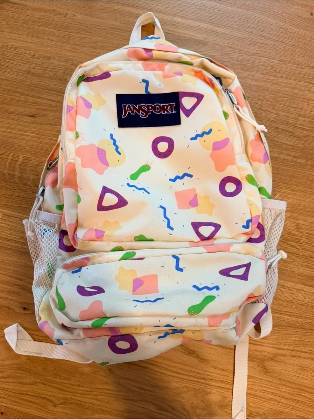 Jansport Cream Backpack with Pastel Pink, Purple & Green Shapes